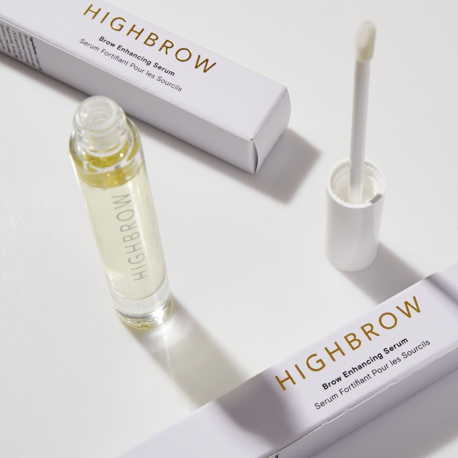 HIGHBROW by M.S. Skincare brow serum in glass bottle with white applicator wand