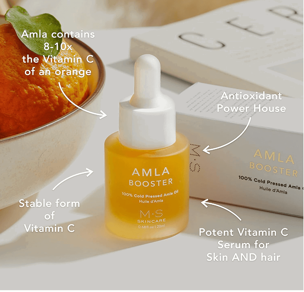 M.S Skincare AMLA OIL for face and body-frosted luxury white bottle and dropper and white printing on a lifestyle backdrop.