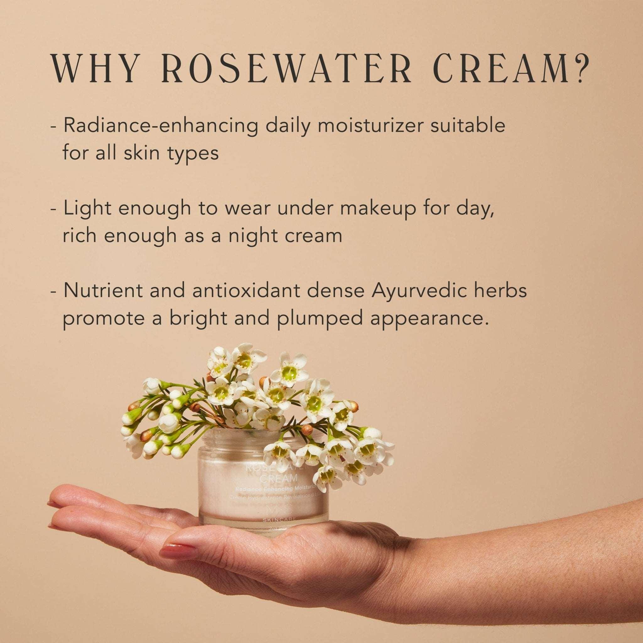 Open jar of M.S Skincare ROSEWATER CREAM Radiance Enhancing Moisturizer on an outstretched hand with white flowers.